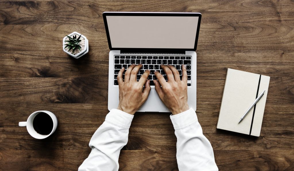 hands laptop man work desk